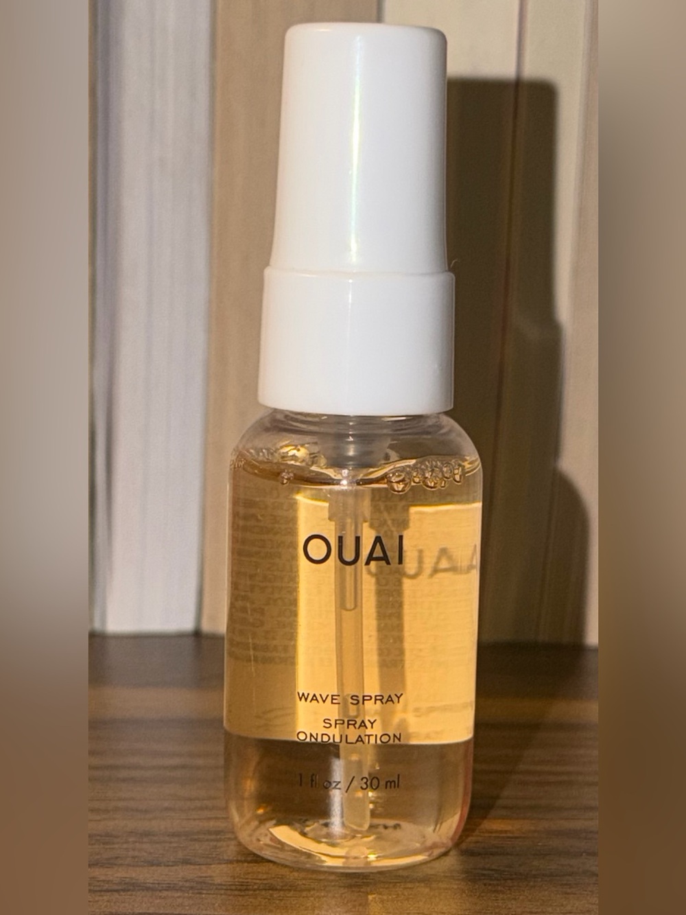 OUAI Wave Spray in Gold-Tinted Bottle